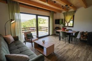 a living room with a couch and a table at Josahouse in Bjeluša