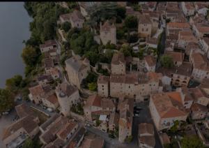 an aerial view of a small town with houses at Logis du Bourg in Puy-lʼÉvêque