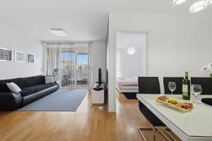 a living room with a couch and a table at Apartman Tonka in Šibenik