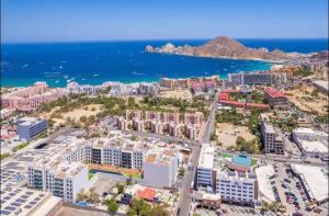 an aerial view of a city and the ocean at 2BDR Condo Beach Downtown Jacuzzi Pool Amenities in Cabo San Lucas