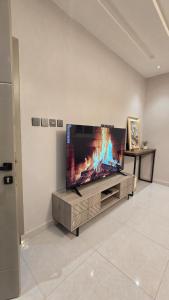 a large flat screen tv on a wall in a living room at ليالي القمر 2 in Sūq ath Thalut