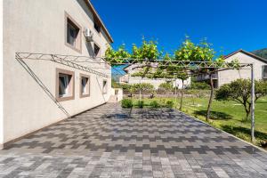 a walkway leading up to a building at Apartments Ivo Bozinovic in Tivat