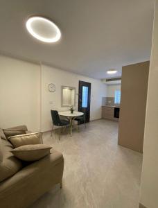 a living room with a couch and a table at Malka Suites in Beit Shemesh