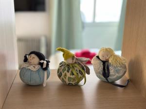 a group of dolls sitting on a shelf at Soca treasure with free parking in Bovec