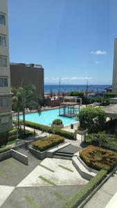 a view of a swimming pool from a building at Keyspace condotel in Piapi