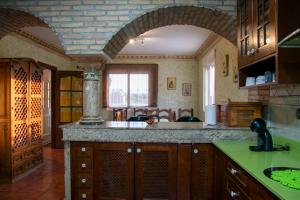 a kitchen with a sink and a counter top at Casa rural Cavila in Pliego