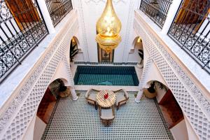 an overhead view of a lobby with a table and chairs at Riad Secret De Medina in Marrakesh