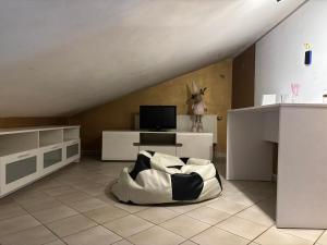 a living room with a couch and a tv at Second&Home in Przeźmierowo