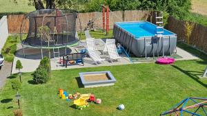 an aerial view of a playground in a backyard at Rajska Zatoka Jantar in Jantar