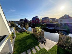 arial view of a house with a river with houses at Waterfront in Alkmaar