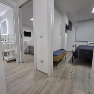 a room with a bedroom with a bed and a window at Lido Appartamento Parcheggio Privato 400 mt dal mare in Lido di Camaiore