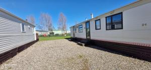 two mobile homes are parked next to each other at No 21 The Tummel in Forfar