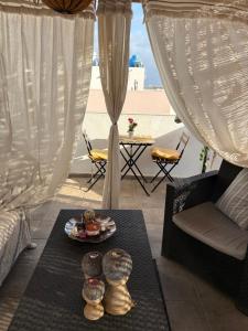 a room with a table with plates of food on it at Atico Dolce Natura in Arrecife