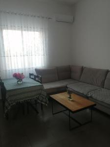 a living room with a couch and a table at Holiday house in Laknas