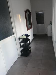 a hallway with a room with a mirror and a shelf at Holiday house in Laknas