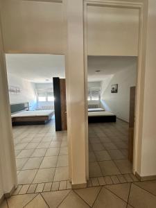 a hallway with two beds in a room at B&B bellinzona gino in Bellinzona