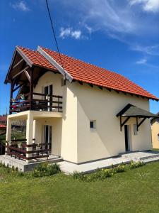 a small house with a red roof at Tara Nest in Kaludjerske Bare