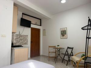 a kitchen and a living room with a table at Old Town - Guest House in Stari Bar
