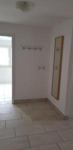 a white room with a mirror on the wall at Griesenstraße in Warendorf
