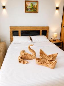 a towel of a snake on a bed at Luxury Studio Pool & Free Private Beach, Close to Airport in Hurghada