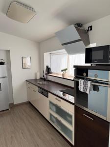 a kitchen with a sink and a stove top oven at Auszeit nahe Freizeitpark in Grethem