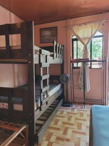 a room with two bunk beds and a window at Alojamiento Artola in Artola