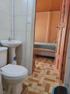 a bathroom with a toilet and a sink at Alojamiento Artola in Artola