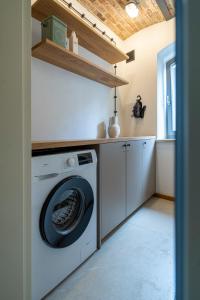 a laundry room with a washer and dryer at apartamenty64200 in Wolsztyn