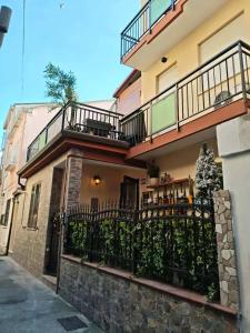 a building with a balcony and a fence at Ca Giulia in Chioggia