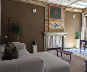 a living room with a couch and a fireplace at Provencal Escape - Suite in Saint Paul de Vence