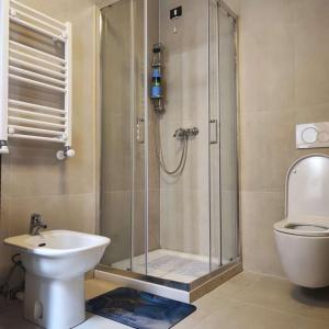 a bathroom with a shower with a toilet and a sink at Ca Giulia in Chioggia +28 photos