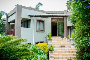 a house with plants in front of it at Noah Garden in Johannesburg
