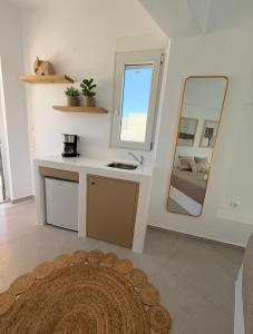 a bathroom with a sink and a mirror at K&M studio in Naxos Chora