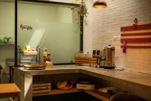 a kitchen with a counter top with a coffee maker at Santa Josefita in Cholula