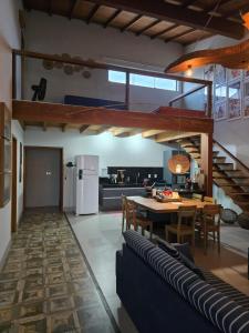 a kitchen and dining room with a table and chairs at Cabana da Cris in Anchieta