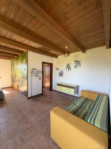 a bedroom with a bed and a table in a room at Alta Quiete in Frontone
