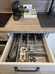 a drawer in a kitchen with a sink at Stadtoase Wels III in Wels