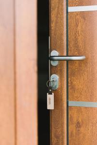 a wooden door with a lock on it at Casa Arte in Ulcinj