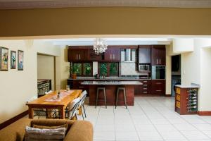 a kitchen with a table and a dining room at Noah Garden in Johannesburg