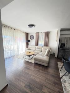 a living room with a white couch and a table at Villa Marea in Nin