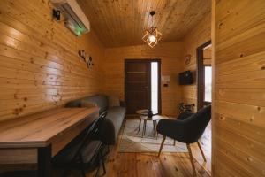 a wooden room with a wooden table and chairs at Casa Arte in Ulcinj +11 photos
