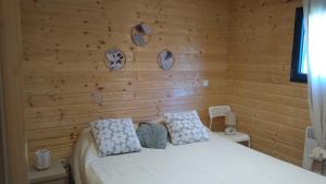 a bedroom with a bed with a wooden wall at L'Insolite in Melun