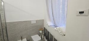 a bathroom with two toilets and a window at HOUSE Sant'Angelo in Acquapendente +100 photos