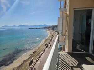 a balcony of a building with a view of the beach at Hawaii Beach Can Picafort in Can Picafort