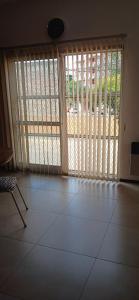 a room with a large sliding glass door with a patio at Casa en planta alta in Rosario