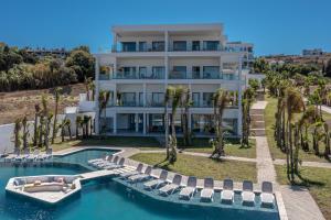 an image of a house with a swimming pool and chairs at Le Tanger Résidence Hôtelière in Tangier