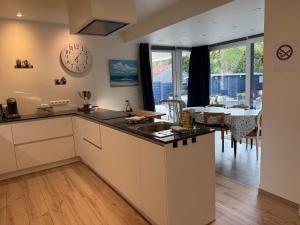 a kitchen with a sink and a counter top at Blue Cottage Bruxelles Sud in Wavre