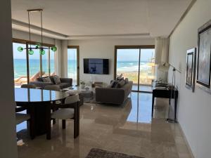 a living room with a view of the ocean at Carrousel Atlantic View in Rabat