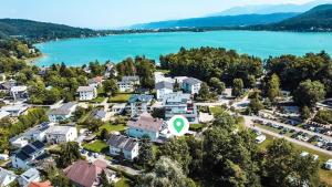 an aerial view of a town with a lake at Lakeside Diamond Apartment - Krumpendorf in Krumpendorf am Wörthersee