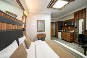 a hotel room with a bed and a desk at La Serena Taksim in Istanbul